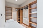 Twin rollaway bed can be set up anywhere shown in master closet 